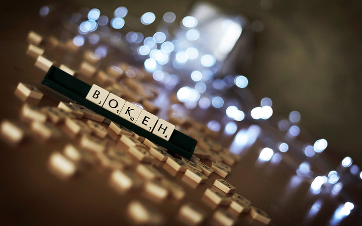white bokeh scrabble tiles, text, board games, numbers, blurred