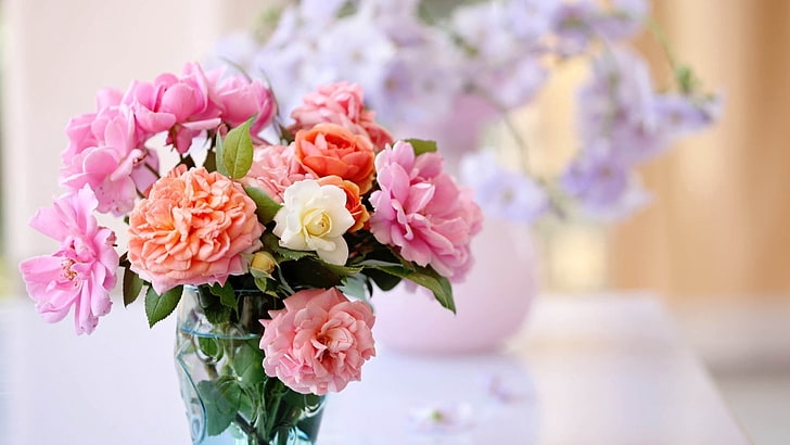 orange, white, and pink carnation and roses centerpiece, bouquet
