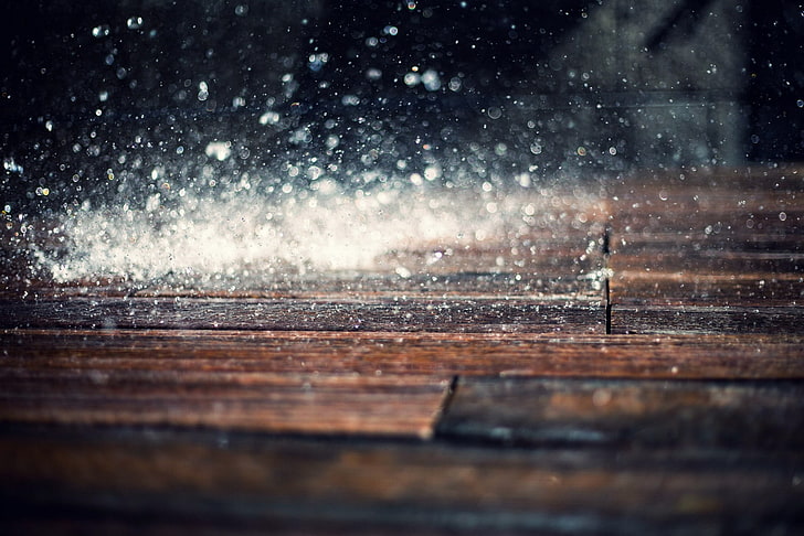brown parquet flooring, timelapse photography of rain drops hits on parquet floor