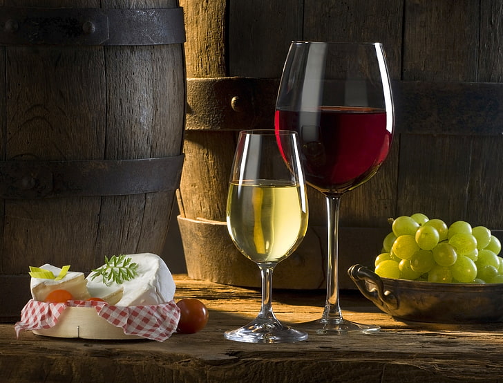 two clear wine glasses, the sun, red, white, shadow, cheese, grapes