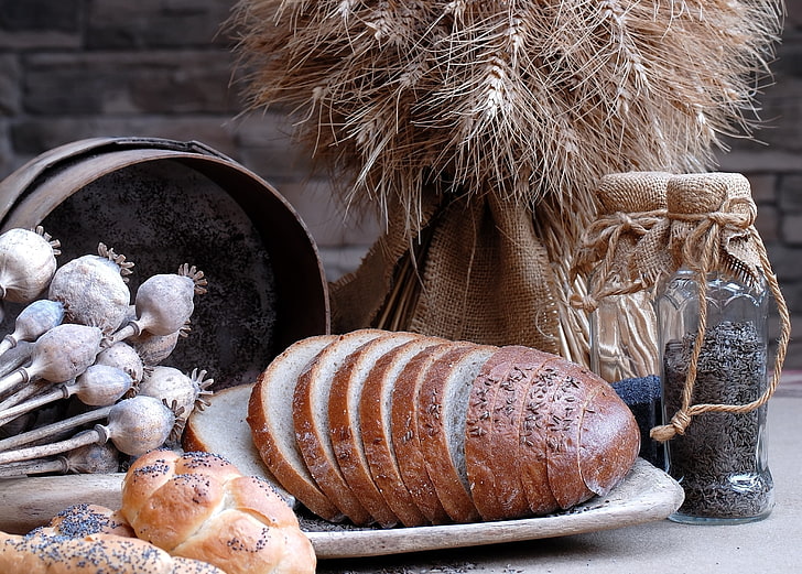 baked breads and glass bottles, poppy seeds, caraway seeds, sunflower seeds
