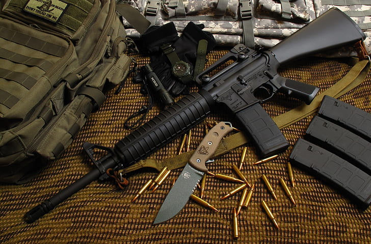 Assault rifle 5.56mm m16 Colt carbine with tactical chest rigs. Military  Equipment. Stock Photo | Adobe Stock