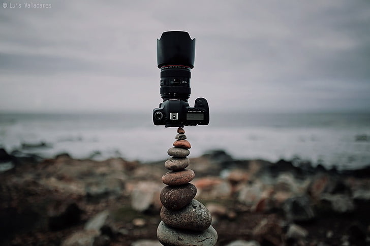 black DSLR camera, photography, nature, symmetry, rocks, clouds