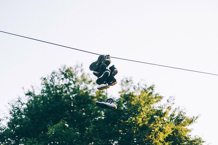 A Pair of Sneakers Hanging on a Power Line Stock Illustration -  Illustration of overhead, sneakers: 283323685