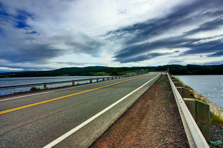 concrete road near sea during daytime, Cabot Trail, Scenic Route