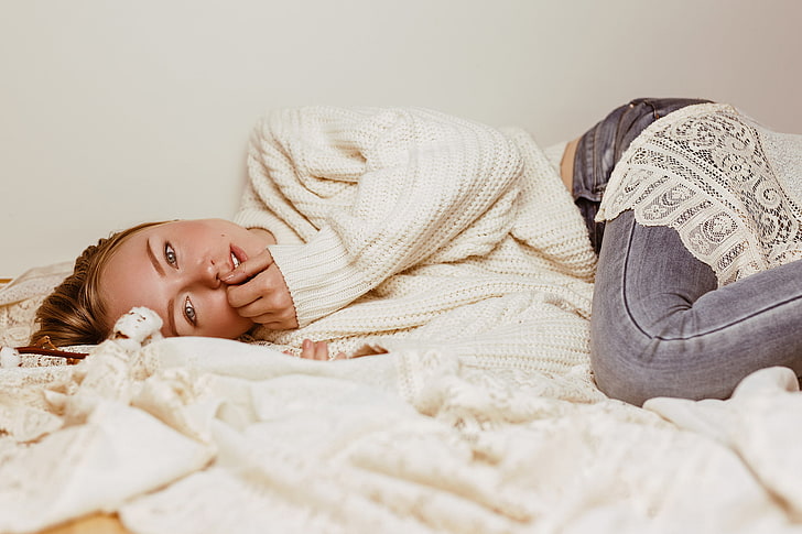 women, model, blonde, sweater, looking at viewer, lying on side
