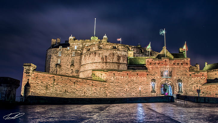 brown castle with flags under cloudy sky at night time, edinburgh castle, edinburgh castle