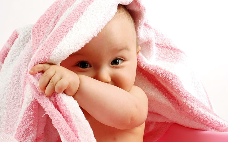 Baby behind a pink towel, pink bathroom towel, children