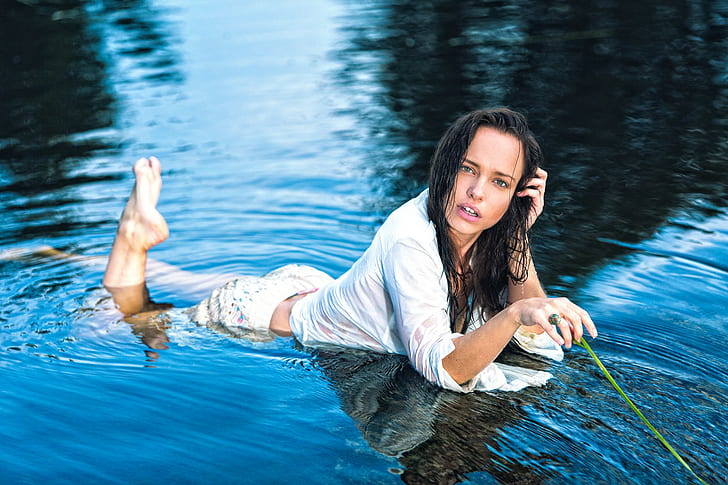 women, wet clothing, black hair, in water, lying on front, feet in the air
