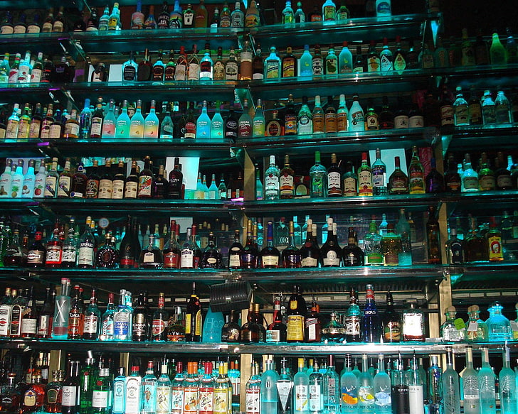 assorted liquor bottles, beer, vodka, whiskey, shelf, large group of objects