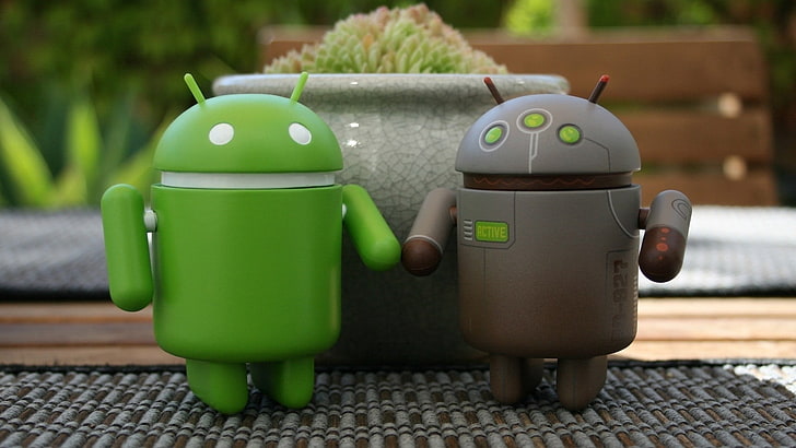 two green and gray Android logo toys, robots, flower bed, carpet, HD wallpaper