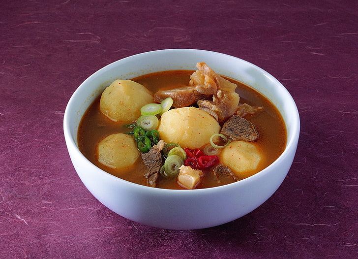 round white ceramic bowl, otato dish, soup, sauce, meat, beef