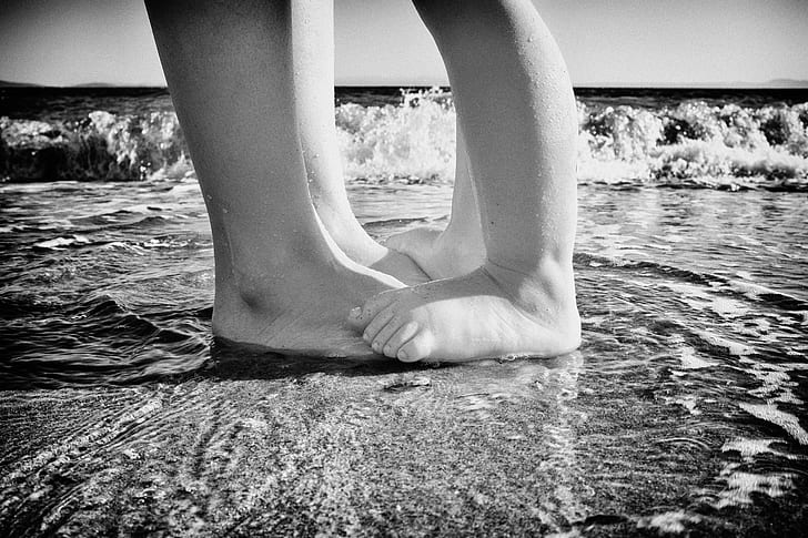 child stepping on mans foot on sea shore, Summertime, Aegean  Sea