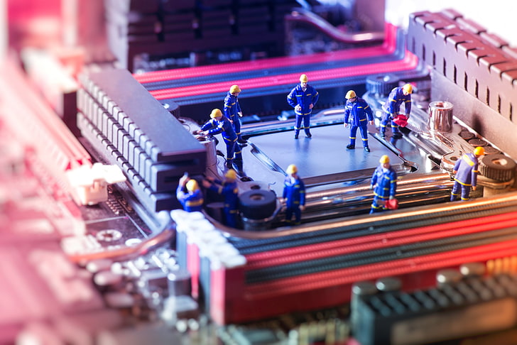 computer processor with people in blue clothes miniature, doll