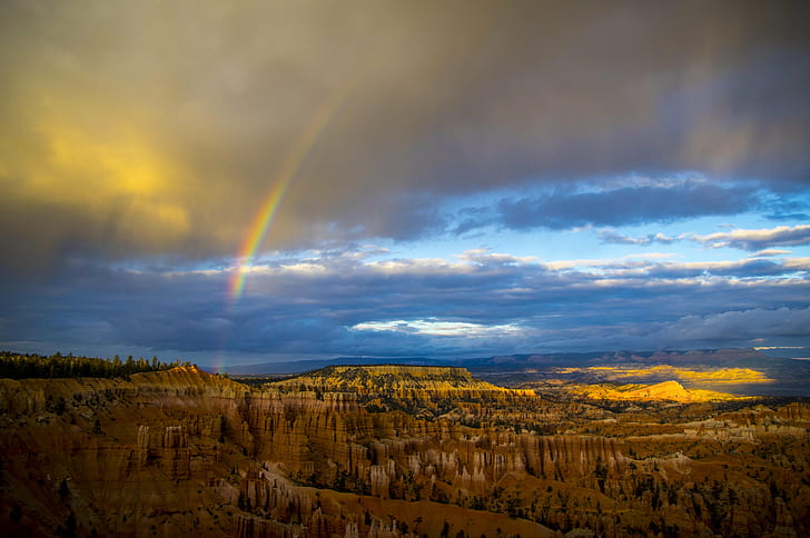 rainbow over the Bryce canyon under blue and cloudy sky, bryce  canyon  national  park