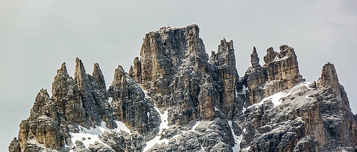 brown Rock Formation filled of snow, Sesto, Dolomites, Innichen  San Candido