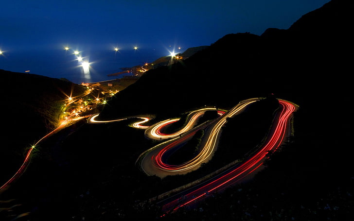 time lapse photography of spiral road at nighttime, long exposure