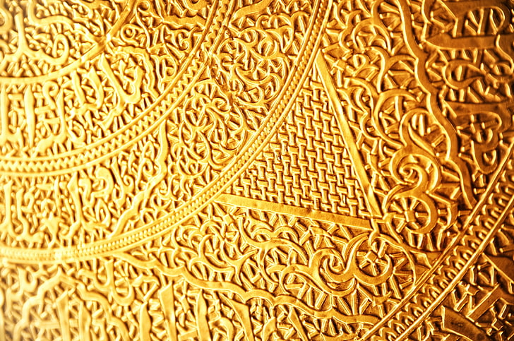 gold-colored scrolled art, pattern, ligature, runes, weaving