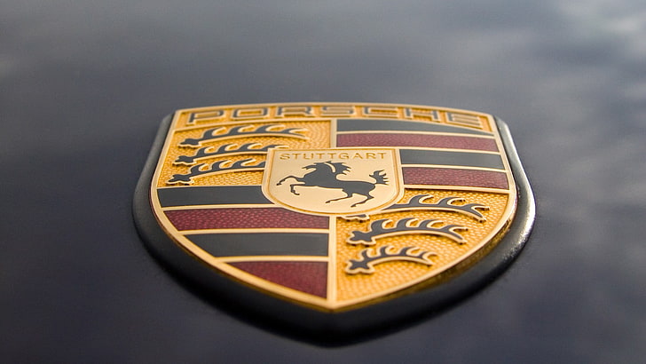 Porsche emblem, logo, close-up, no people, studio shot, indoors