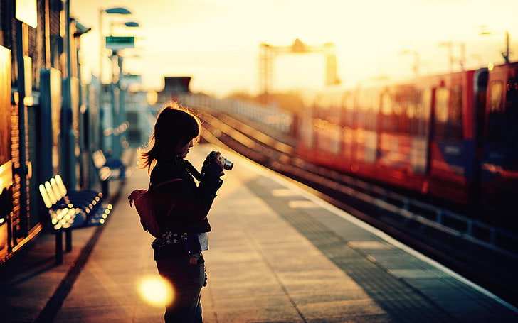 sunset, train station, women, camera, sunlight, one person