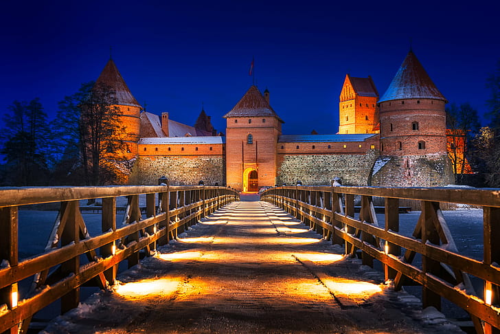photo of bridge hallway to bricked castle during night time, trakai, trakai