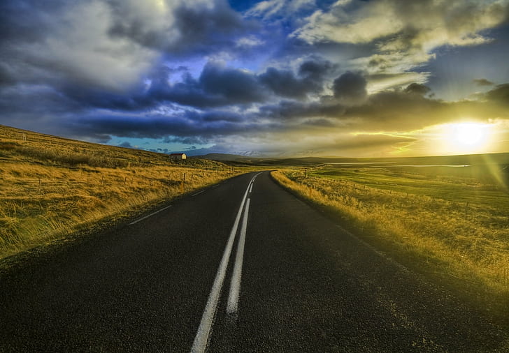 landscape photography of concrete road during nimbus clouds, hdr