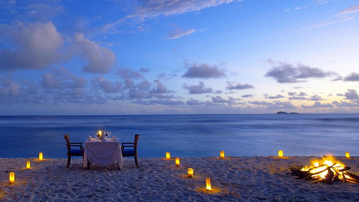 brown wooden 3-piece dining set, beach, the ocean, romance, candles