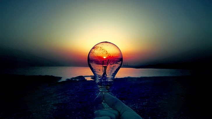 person holding light bulb near seashore, lamp, Sun, sun rays
