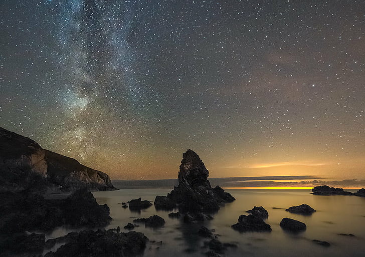 rock formations on beach under starry dusk sky, porth, porth