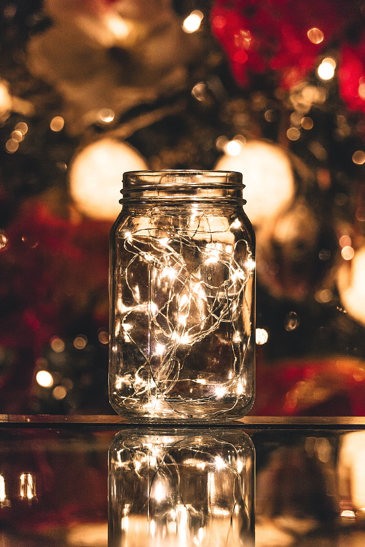 clear glass mason jar with string light, bank, garland, glare
