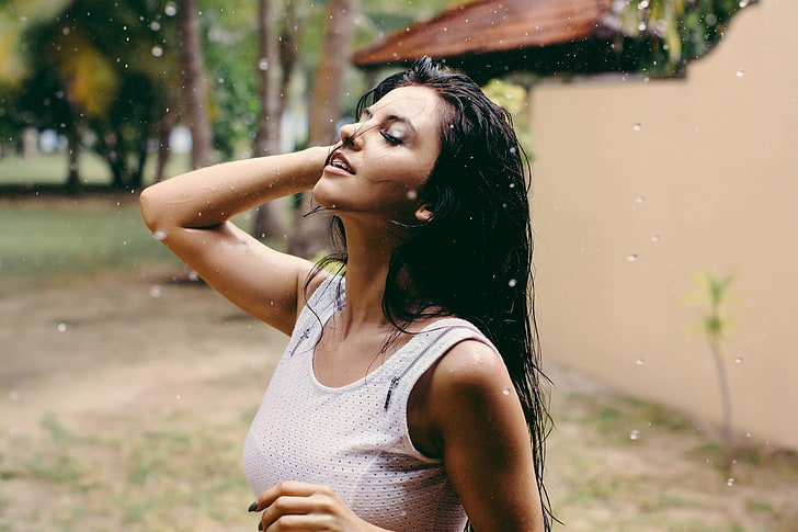 woman wearing white tank top with wet hair at daytime, women
