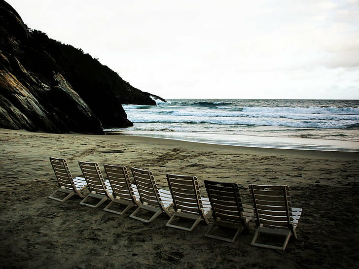 white beach lounger near ocean under white skies, que, Ignacio Sanz