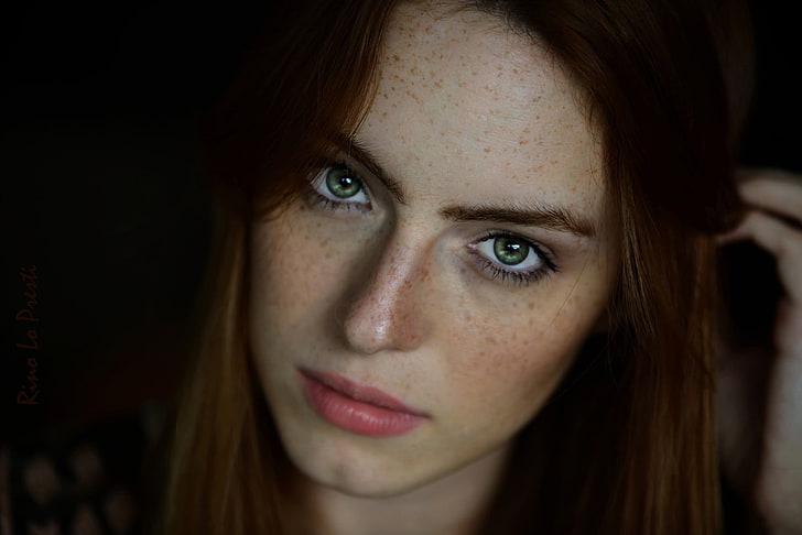 close view of woman holding strands of hair, women, green eyes