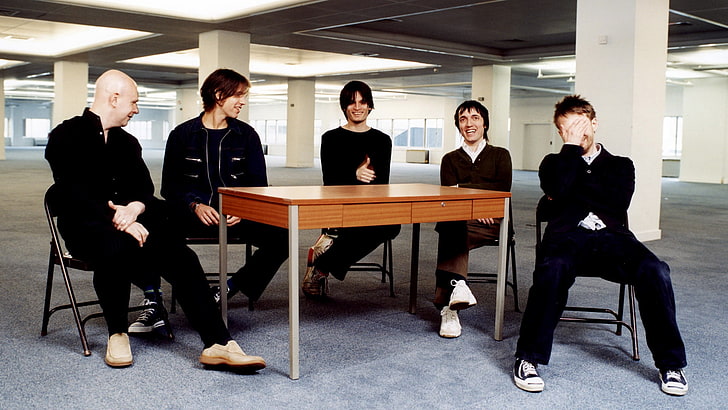 brown wooden table, radiohead, members, laugh, smile, people