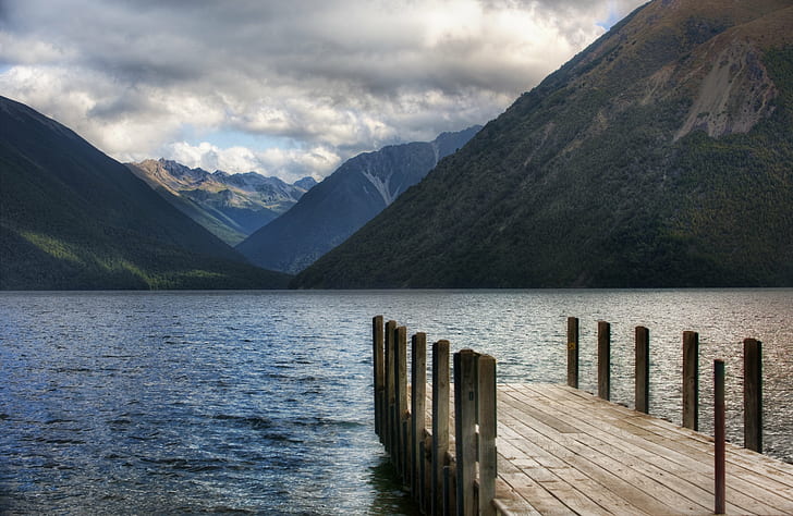 landscape photo of brown wooden dock and mountain near lake, Forever