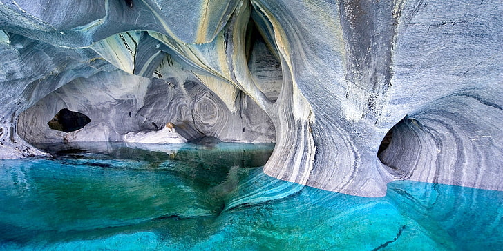 gray rock formation in water, lake, cave, Chile, erosion, turquoise
