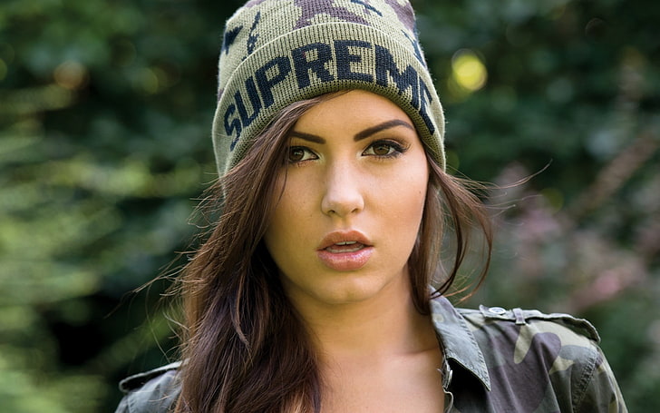 women's green Supreme knit cap, Sabine Jemeljanova, model, brunette