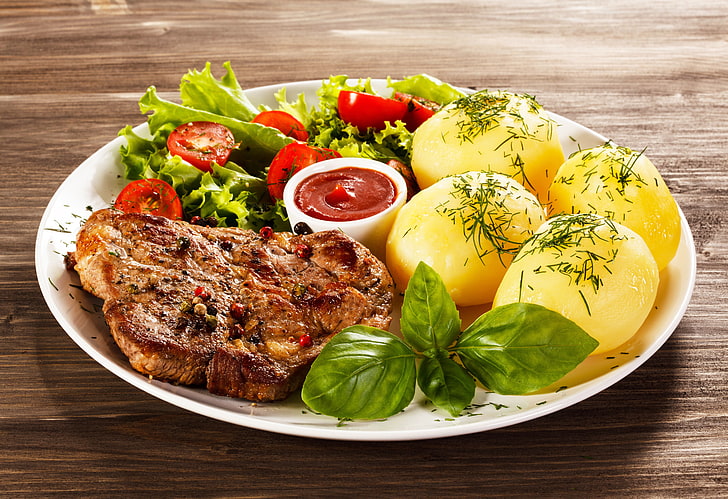 roast meat with potato, tomatoes, sauce, salad, potatoes, steak