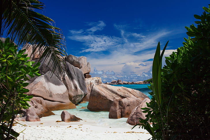 beige stones near the sea during daytime, anse, la digue, seychelles, anse, la digue, seychelles