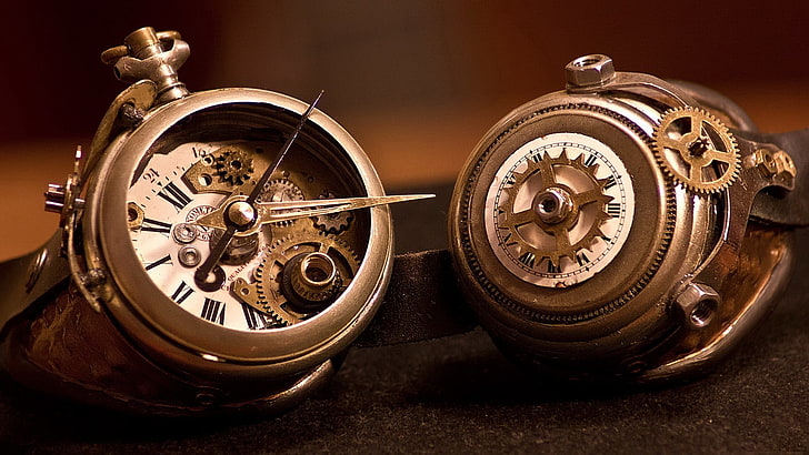 two brown skeleton pocket watches, gears, clockworks, hands, numbers