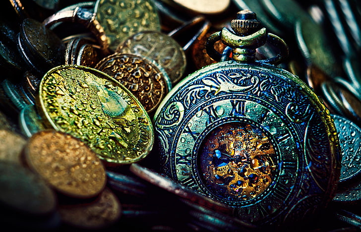 silver-colored and gold-colored medallions, closeup photo of mechanical pocket watch and coins