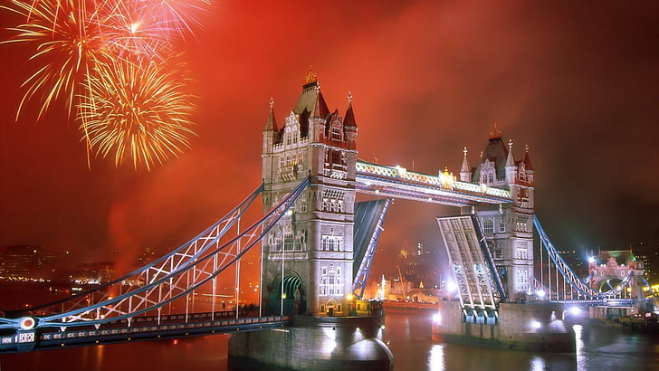 person showing London Tower bridge with fireworks, city, cityscape