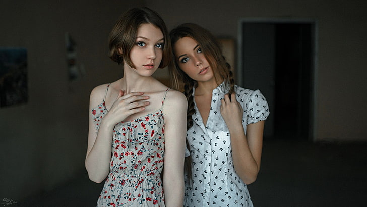 two women's white tops, woman wearing multicolored dress, ponytail