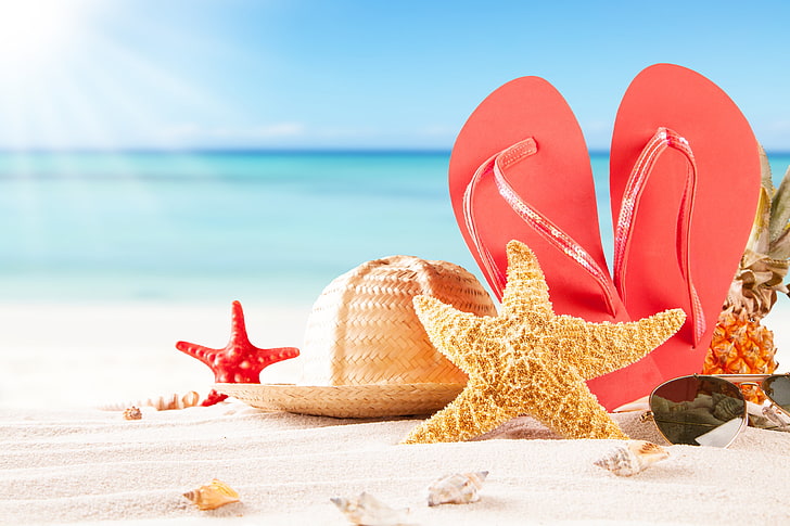 pair of red flip-flops and yellow starfish, sand, sea, beach