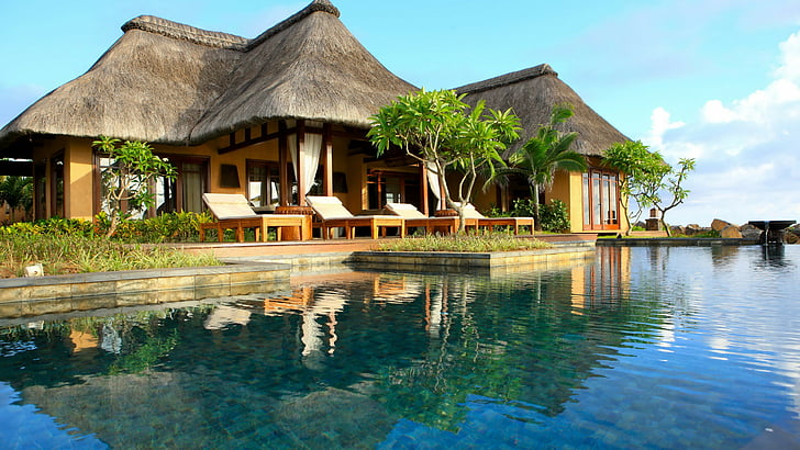 brown and grey cottage near a body of water, Shanti Hotel Nira Resort