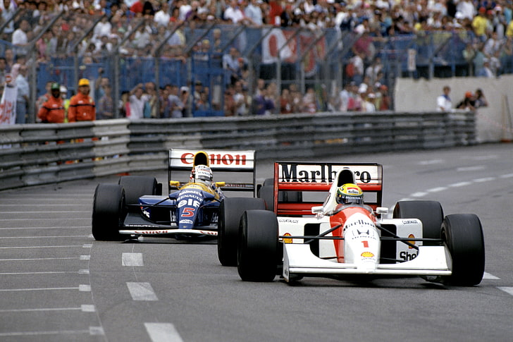 two blue and red formula 1's, Ayrton Senna, Nigel Mansell, McLaren MP4/7
