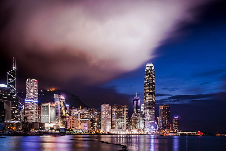 night view photography of high-rise buildings beside body of water, hong kong, hong kong