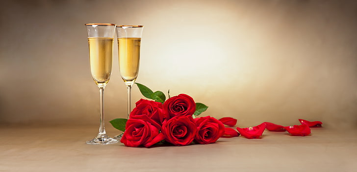 two clear glass champagne flutes, flowers, petals, glasses, red roses
