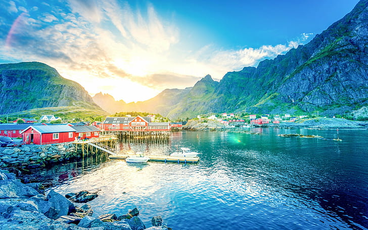 Norway, Lofoten, lake, red wooden house, sun, beach, boats, mountains
