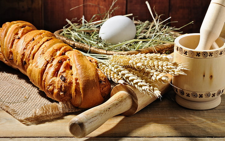 croissant bread and brown rolling pin, table, pounder, ears, egg